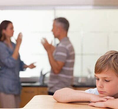 Little boy hearing his parents having am argument — Family law in Uniontown, PA Little boy hearing his parents having am argument — Family law in Uniontown, PA