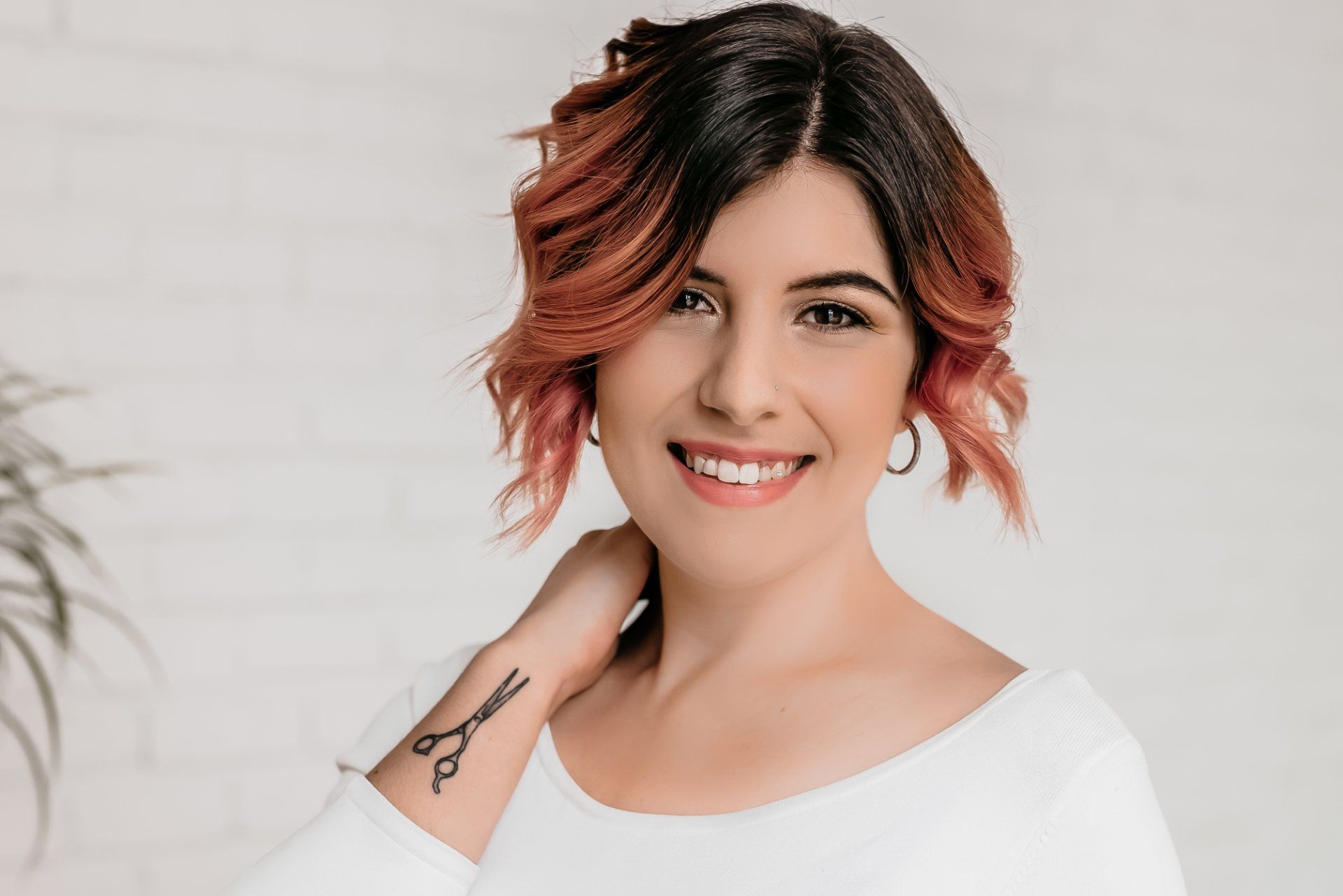 Smiling woman with tattoo on wrist for personal branding gift card