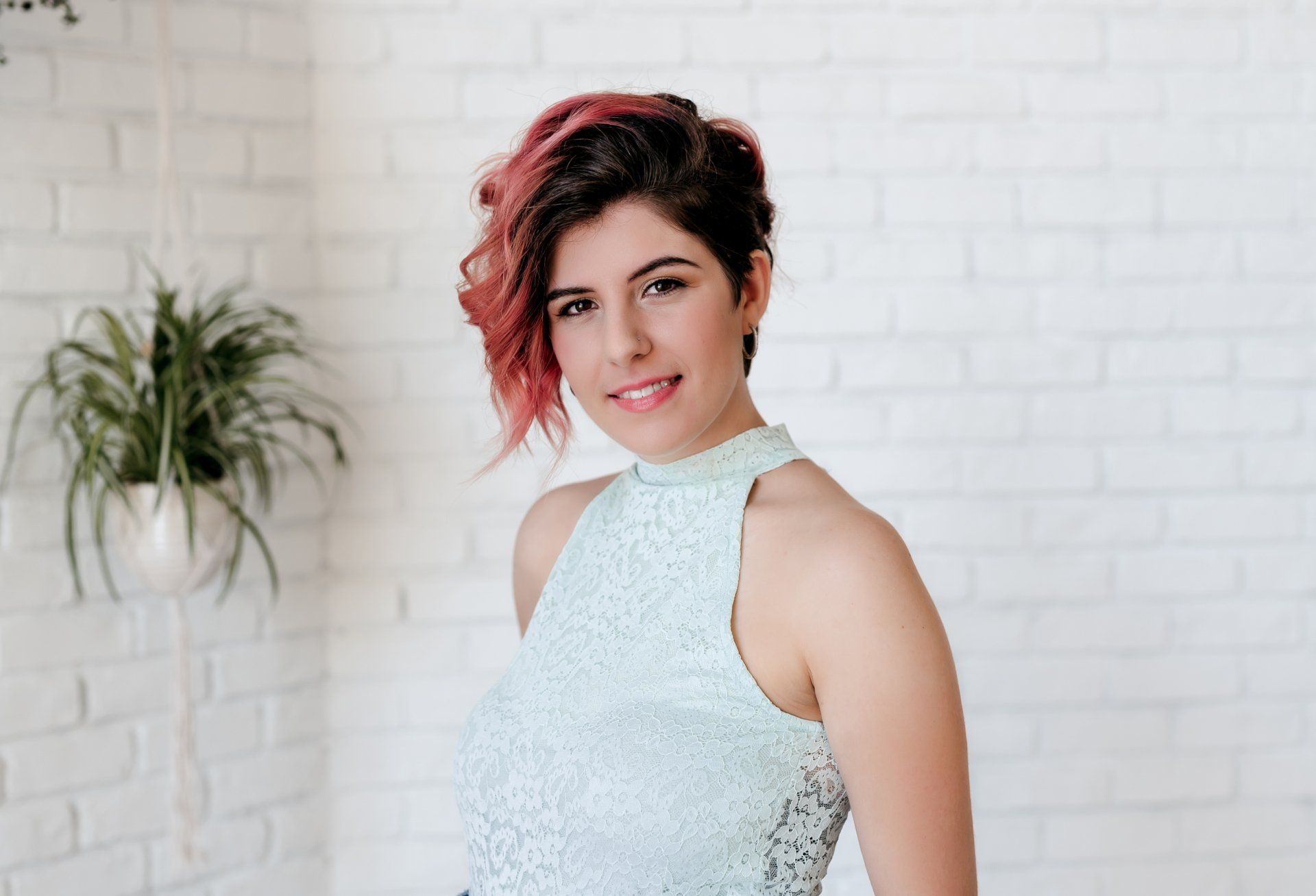 Smiling woman in front of white wall for personal branding gift card