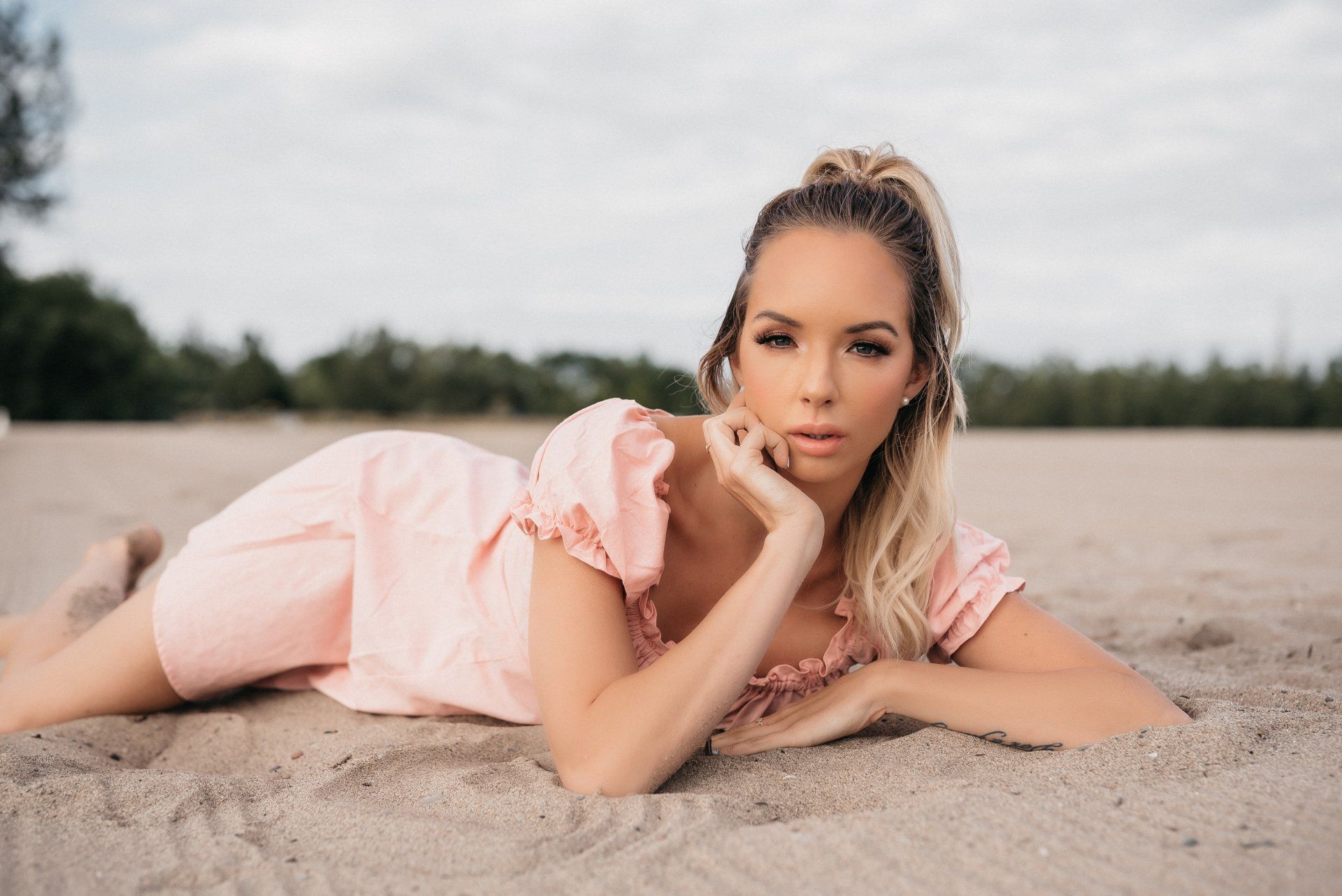 Woman laying in sand on beach for personal branding gift card