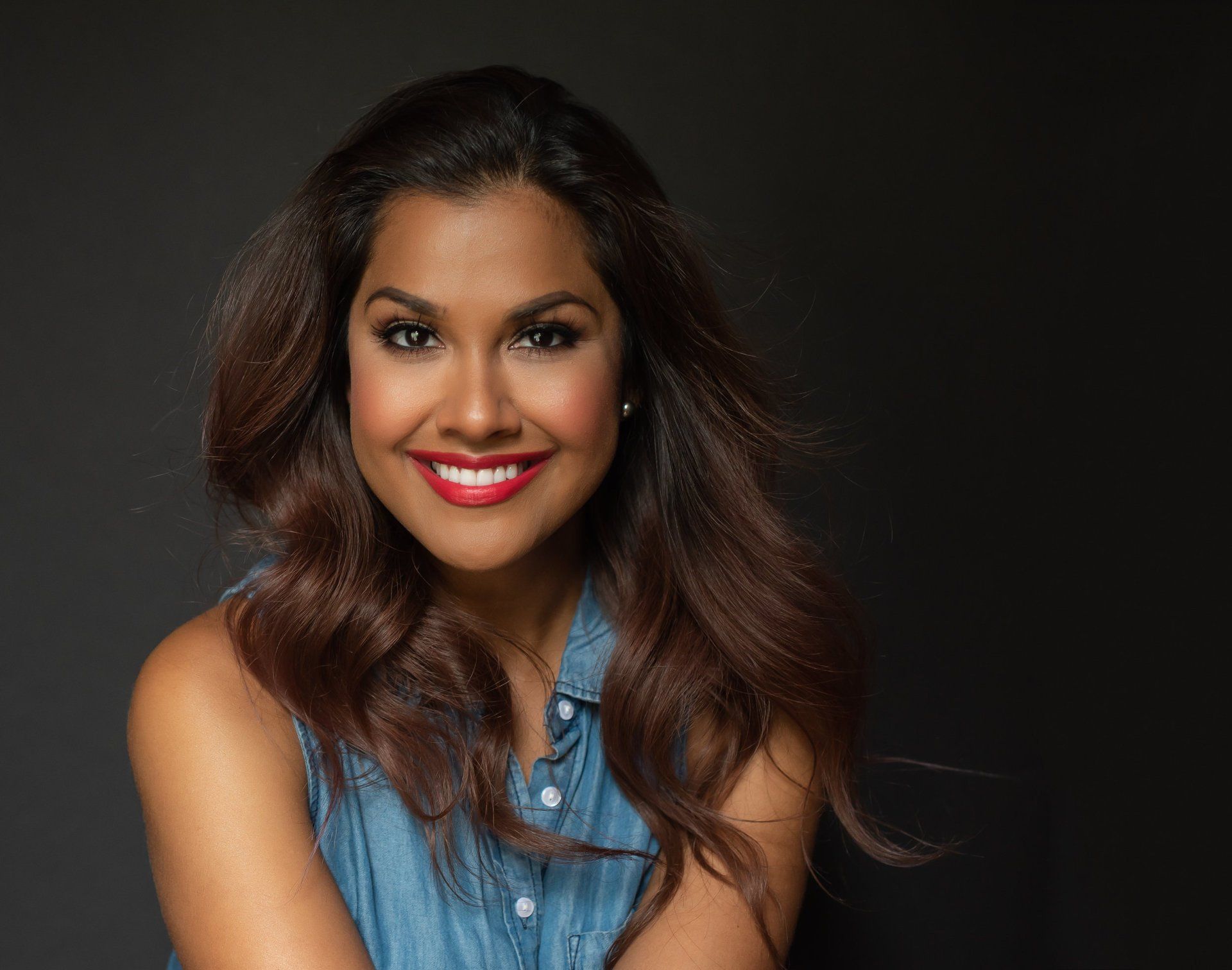 Professional Portrait Photography | Stacey Naglie Toronto  | Smiling woman in front of dark wall