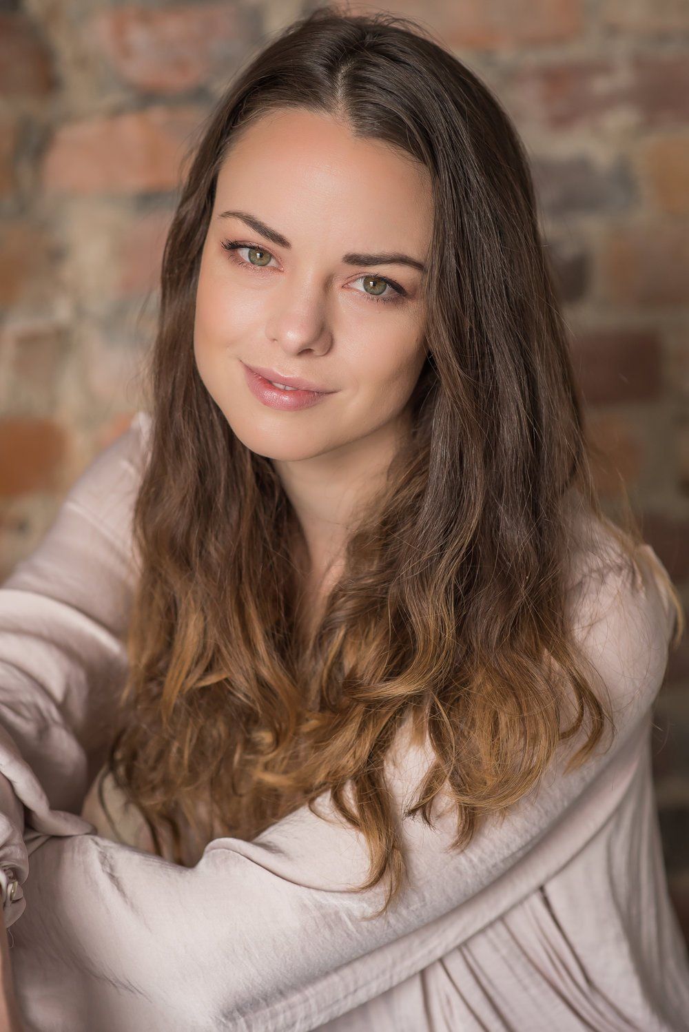 Professional Portrait Photography | Stacey Naglie Toronto  | Woman seated in front of brick wall