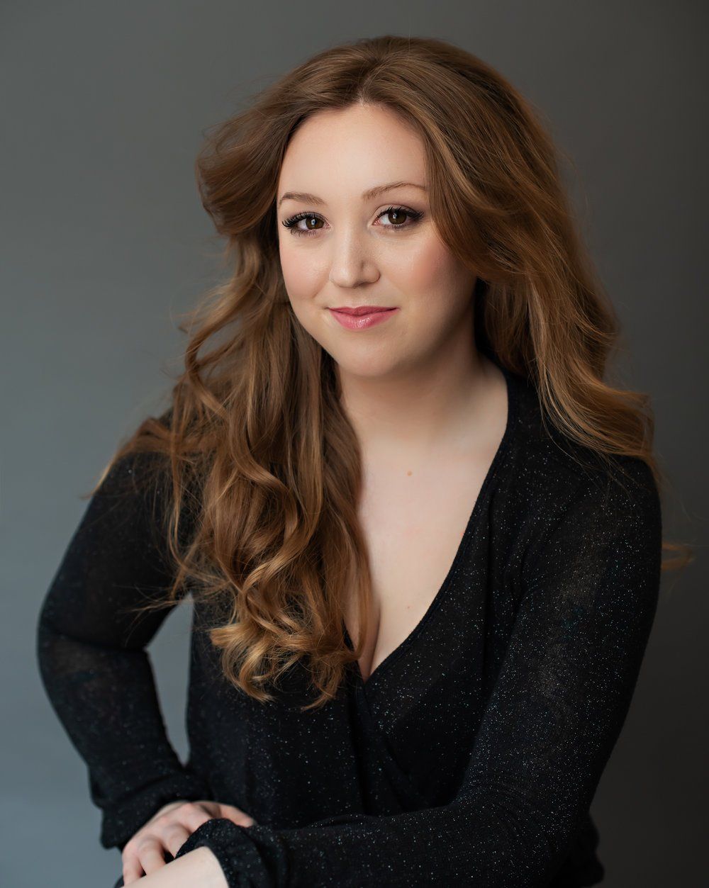 Professional Portrait Photography | Stacey Naglie Toronto  | Smiling woman in front of dark wall