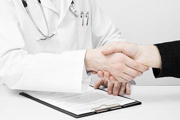 physician shaking hand of patient physician shaking hand of patient