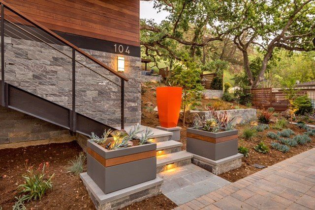 Lit stone steps, retaining wall, planters