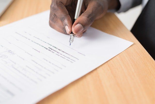 signing a contract with pen