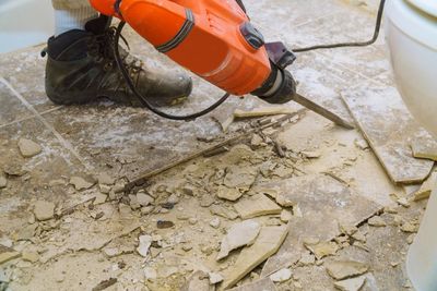 Demolition Of Old Tiles With Jackhammer — Kansas City, KS — REMCO Demolition, LLC Demolition Of Old Tiles With Jackhammer — Kansas City, KS — REMCO Demolition, LLC