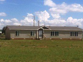 10.5 acres with income producing homes, shop sea containers, orchard, 2 acres water rights and acres of opportunities for RV park, more rental properties, commercial businesses, etc.