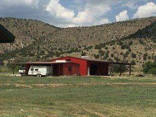 NEW - Lincoln NM irrigated farm with the Bonito Creek running through it - 2 metal barns, awesome well, electricity to property line.