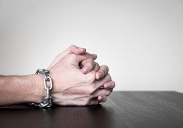 Close up of Male hands with chain - Bail Bonds in Houston, TX Close up of Male hands with chain - Bail Bonds in Houston, TX