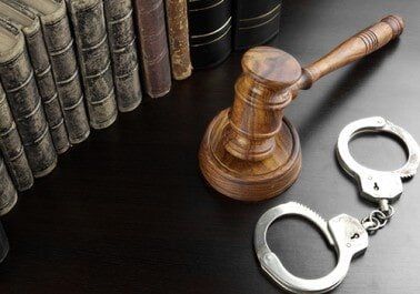Judges Gavel, Handcuffs And Old Book On The Black Table - Bail Bonds in Houston, TX Judges Gavel, Handcuffs And Old Book On The Black Table - Bail Bonds in Houston, TX