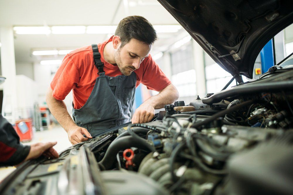 Auto Mechanic Fixing Car Transmission — Cape Girardeau, MO — DL Transmissions