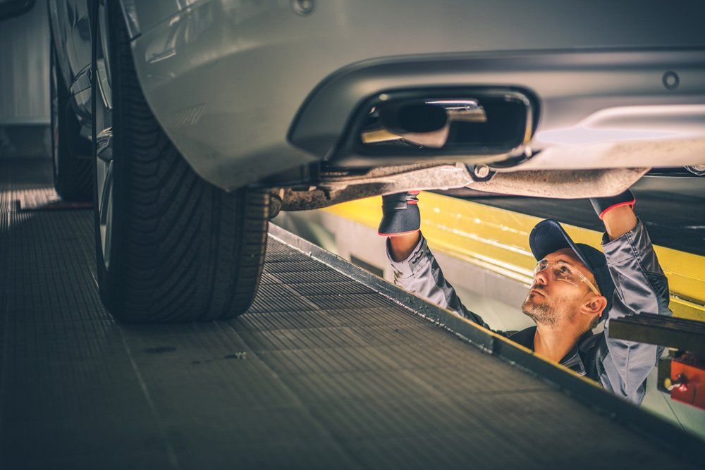 Technician Checking Car Transmission — Cape Girardeau, MO — DL Transmissions