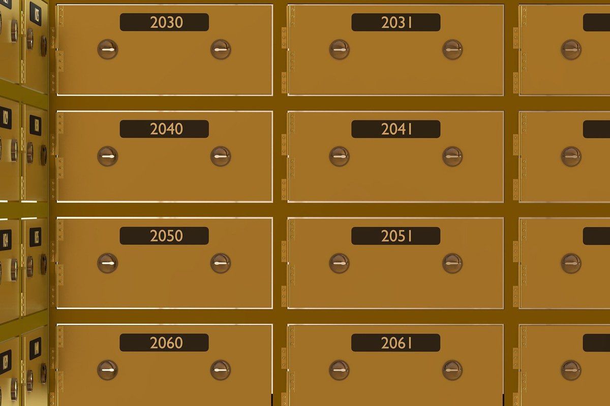 A bunch of gold safes with numbers on them