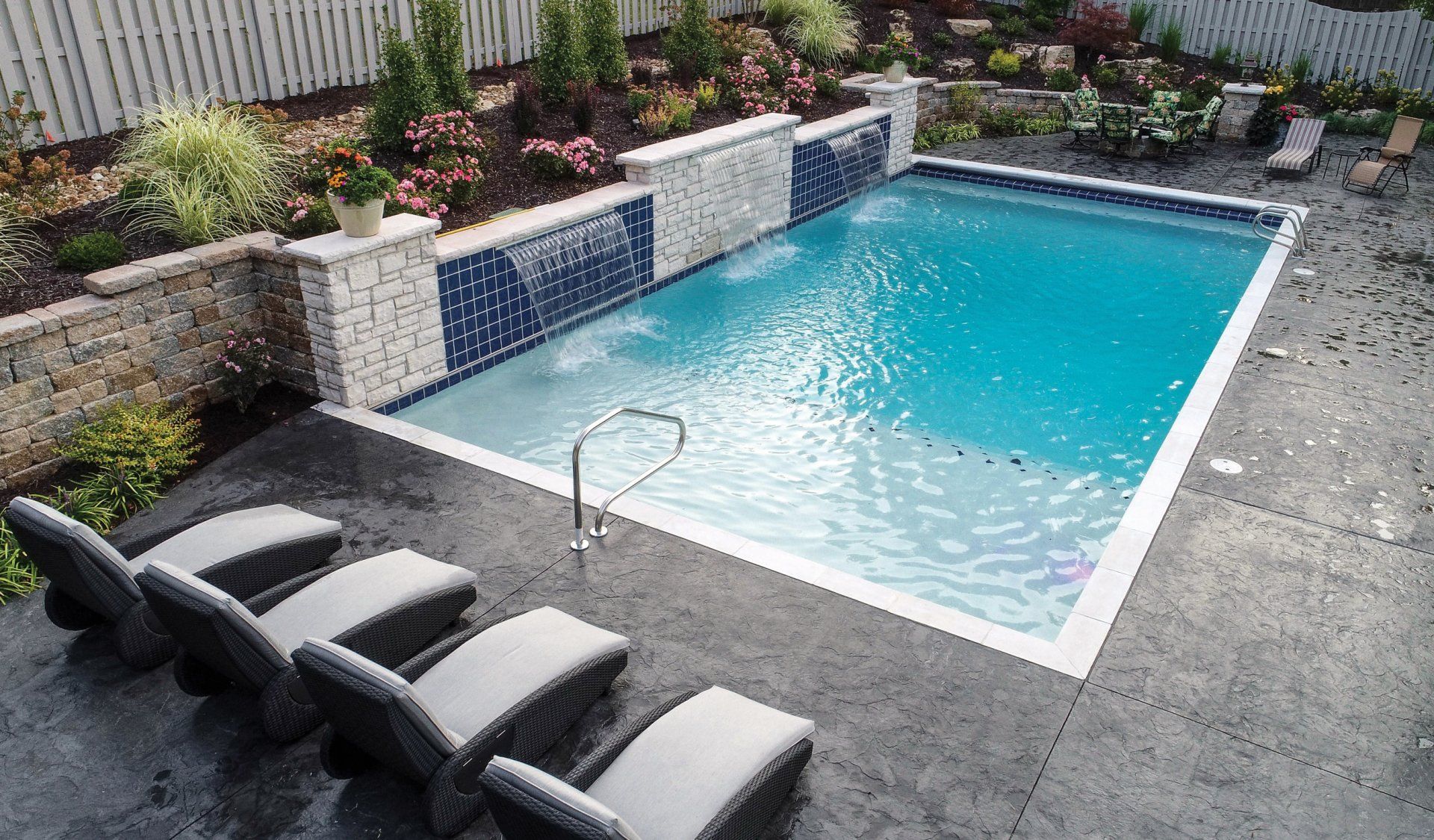 An aerial view of a large swimming pool surrounded by chairs.