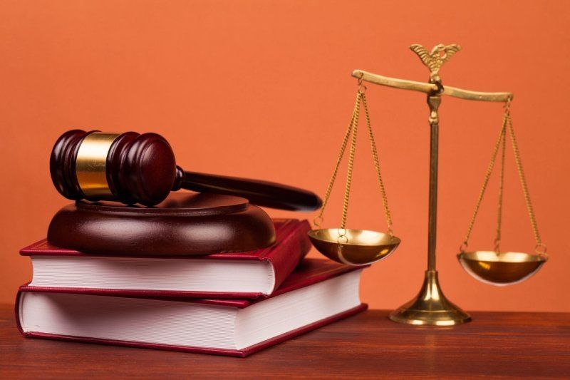 legal reference material with justice and gavel
