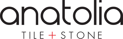 Anatolia Tile + Stone logo with black text and a red plus sign on a white background