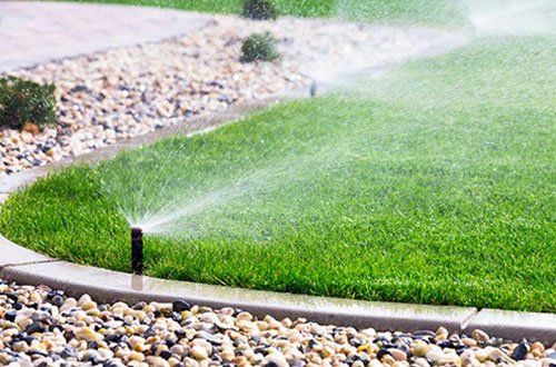 Automatic Sprinklers Watering Lawn — Greer, SC — Smith Irrigation & Landscaping Automatic Sprinklers Watering Lawn — Greer, SC — Smith Irrigation & Landscaping