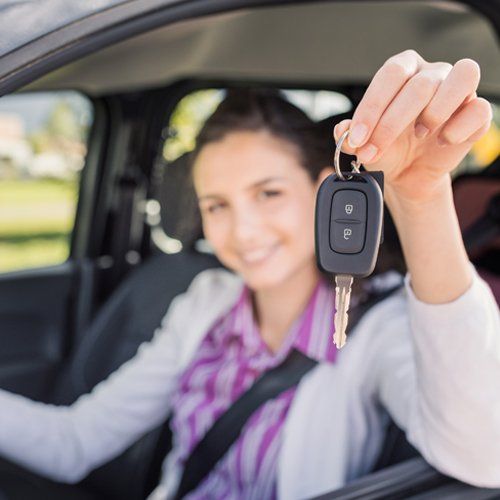 Auto — Woman Holding Key, in Gorda, FL Auto — Woman Holding Key, in Gorda, FL