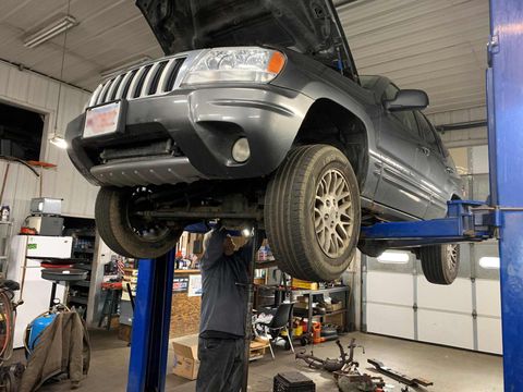 Clutch Repair — Car on Hydraulic Lift in Northbridge, Massachusetts Clutch Repair — Car on Hydraulic Lift in Northbridge, Massachusetts