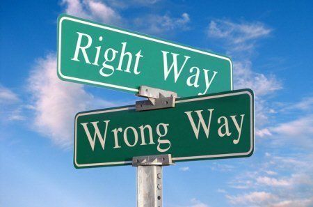 A street sign that says right way and wrong way