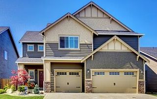 Luxurious Modern House with Two Garage Spaces and Driveway — Door Repair in Jackson, MS Luxurious Modern House with Two Garage Spaces and Driveway — Door Repair in Jackson, MS