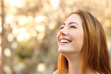 Woman laughing with perfect teeth - Dental Care in Haute, IN Woman laughing with perfect teeth - Dental Care in Haute, IN