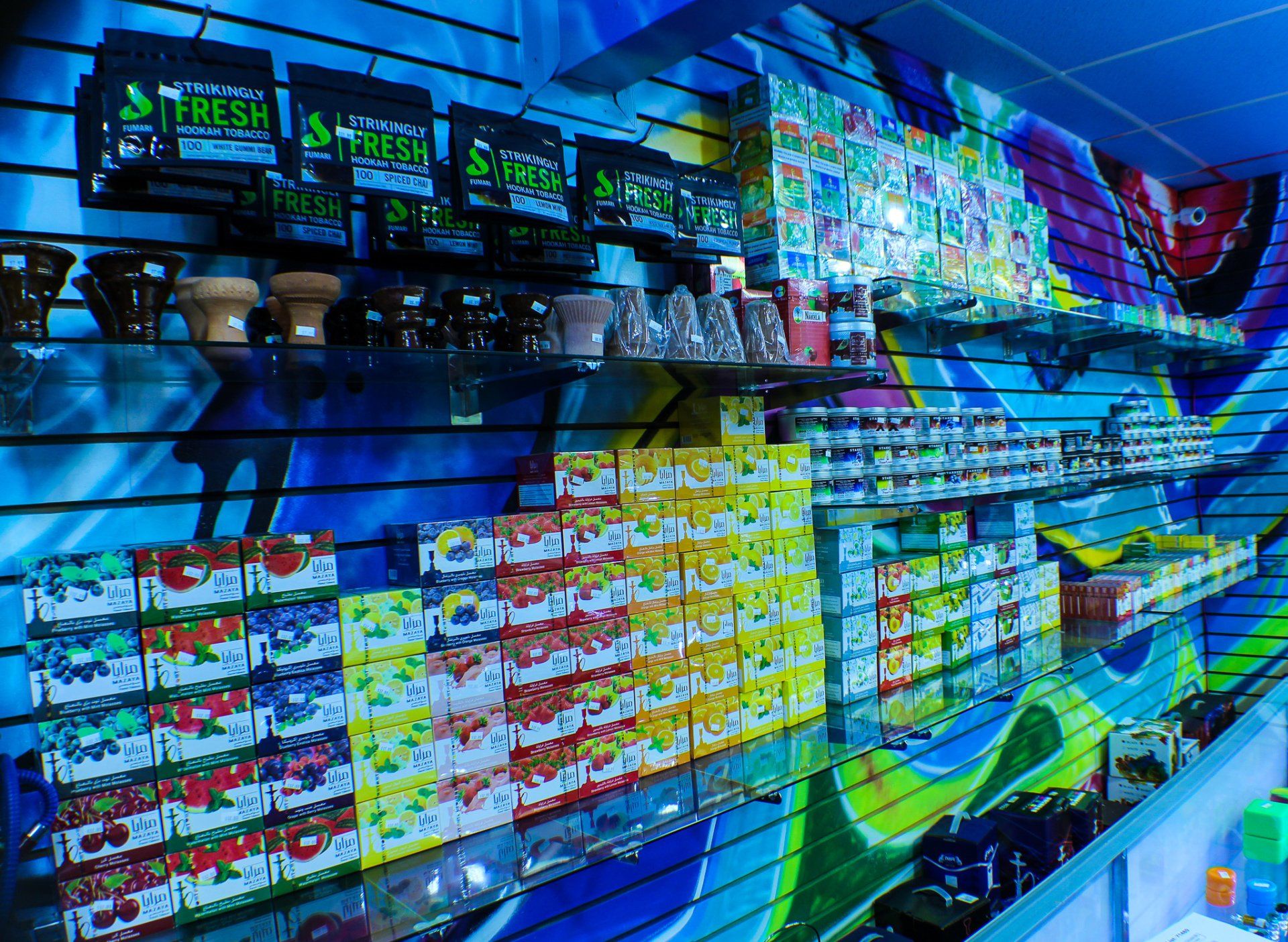 A store with a mural on the wall that says fresh