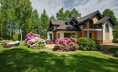 House with Beautiful Garden — Bonita Springs, FL — Saint John Pro Irrigation and Landscaping Services House with Beautiful Garden — Bonita Springs, FL — Saint John Pro Irrigation and Landscaping Services