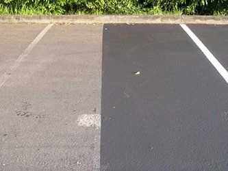 Sealcoating - Left Side No Sealcoat, Right side with Sealcoated Asphalt in Kent, WA