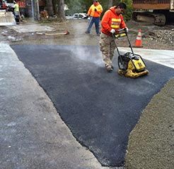 Asphalt Installation - A Worker Applying Asphalt in Kent, WA