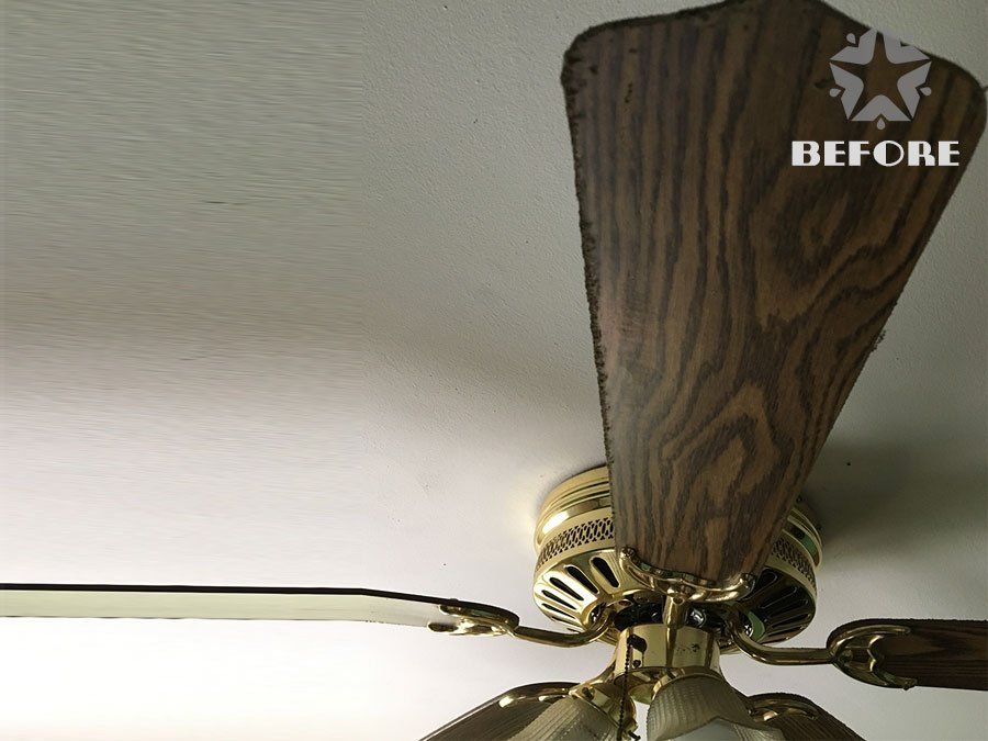 Ceiling fan with wooden blades and brass fixture on a white ceiling, labeled “BEFORE” in the corner