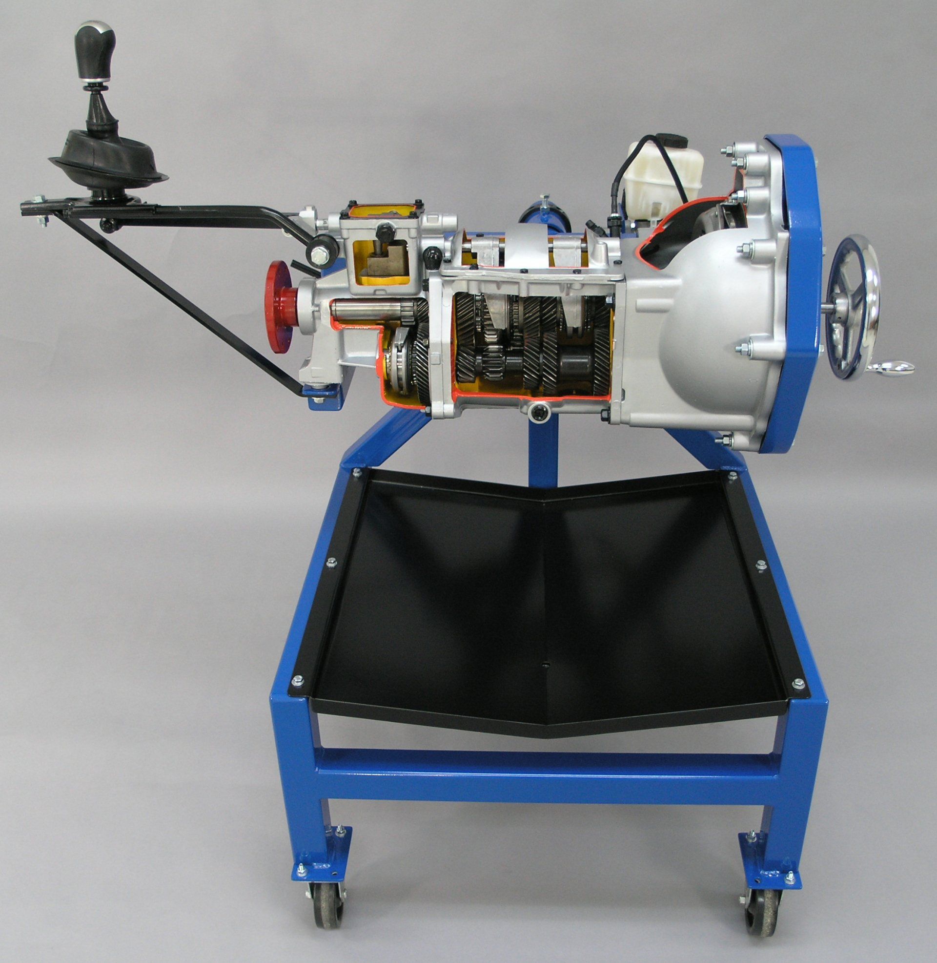 A model of a car engine on a blue stand