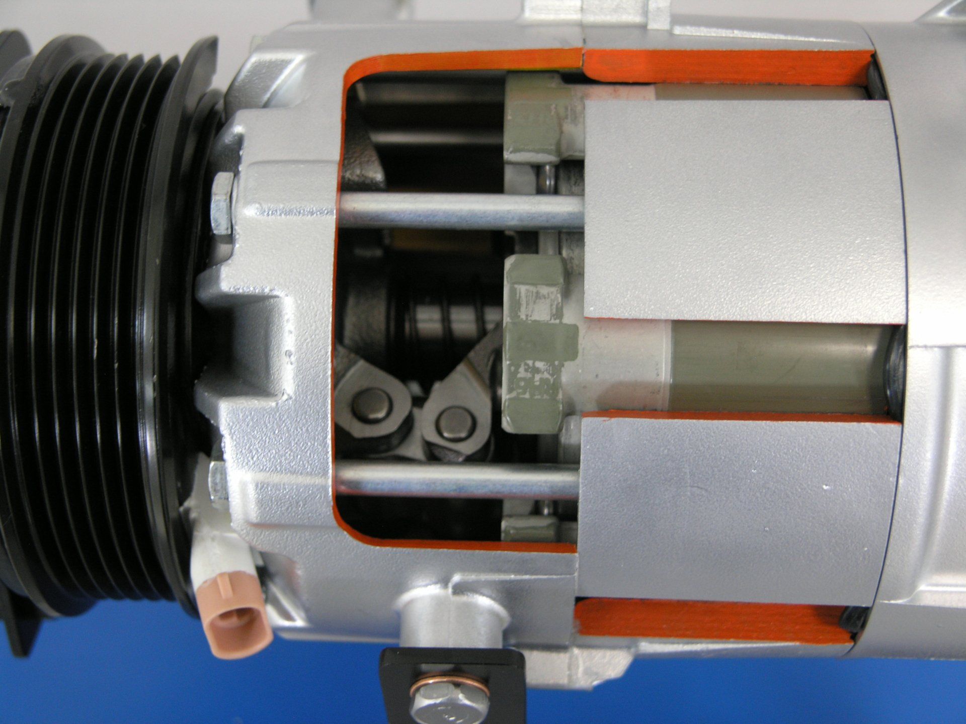 A close up of a car compressor with the letters lp on it