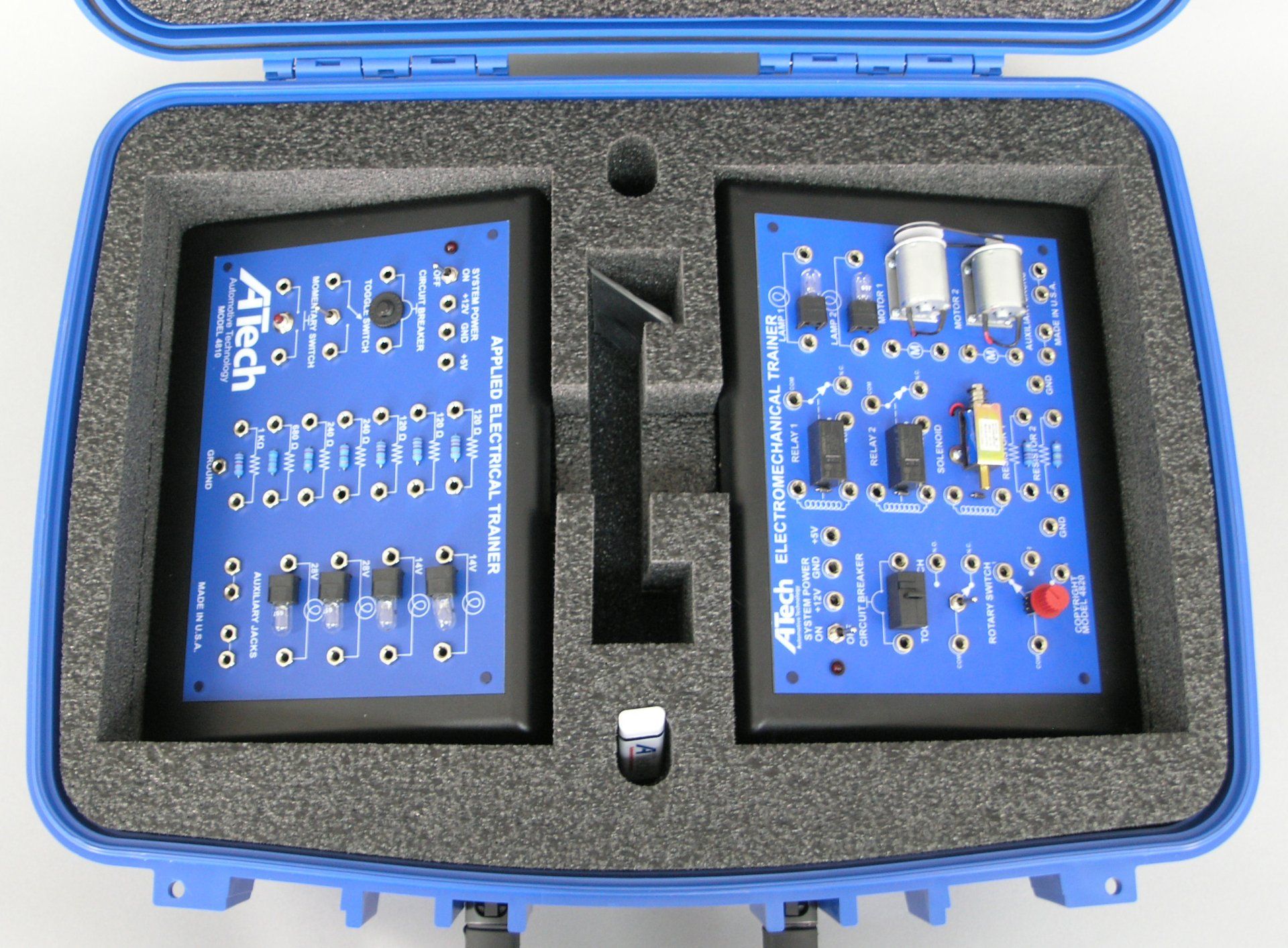 A blue case with two boards inside of it that says ' atech ' on it