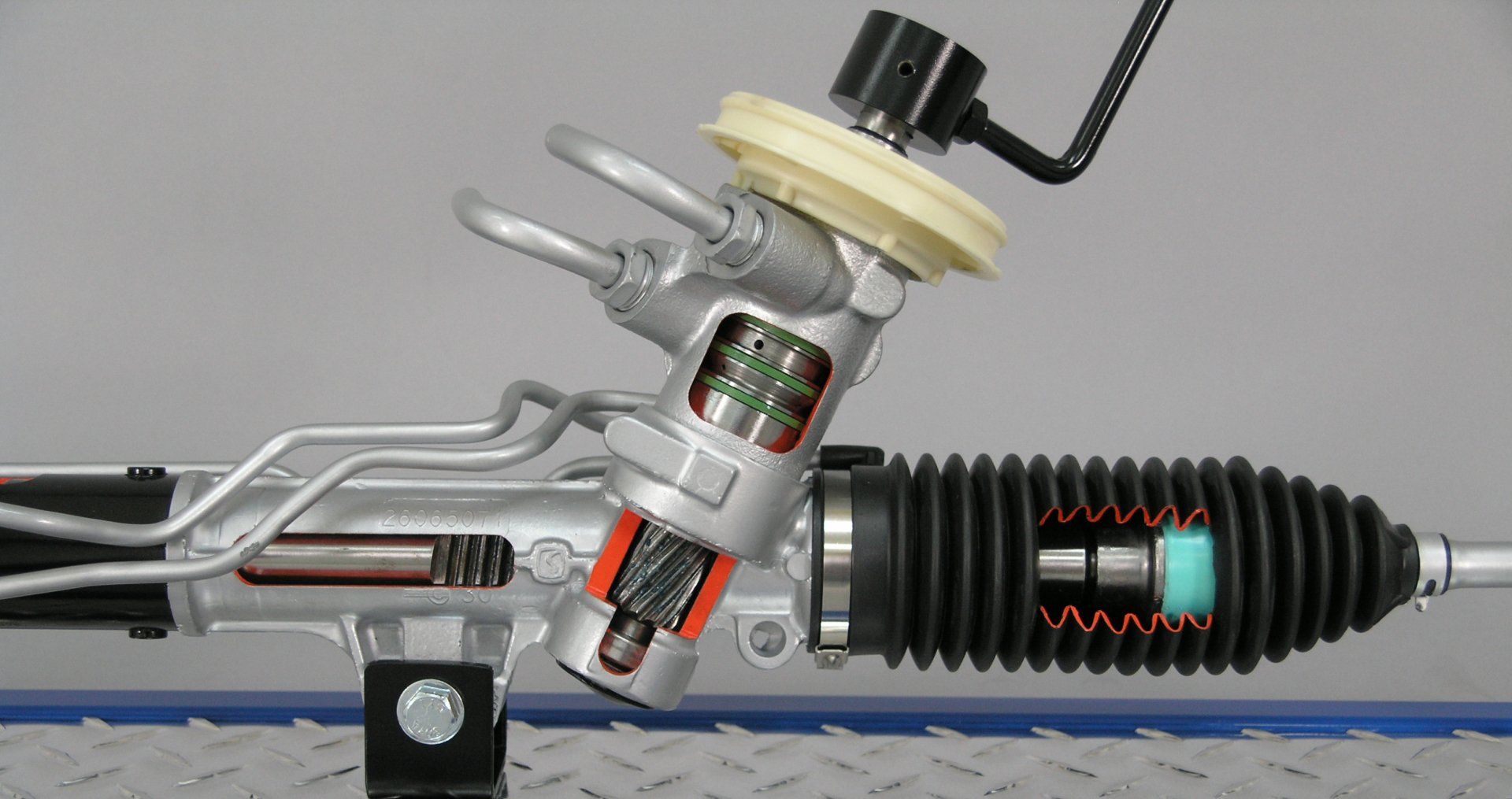 A close up of a steering rack on a table.