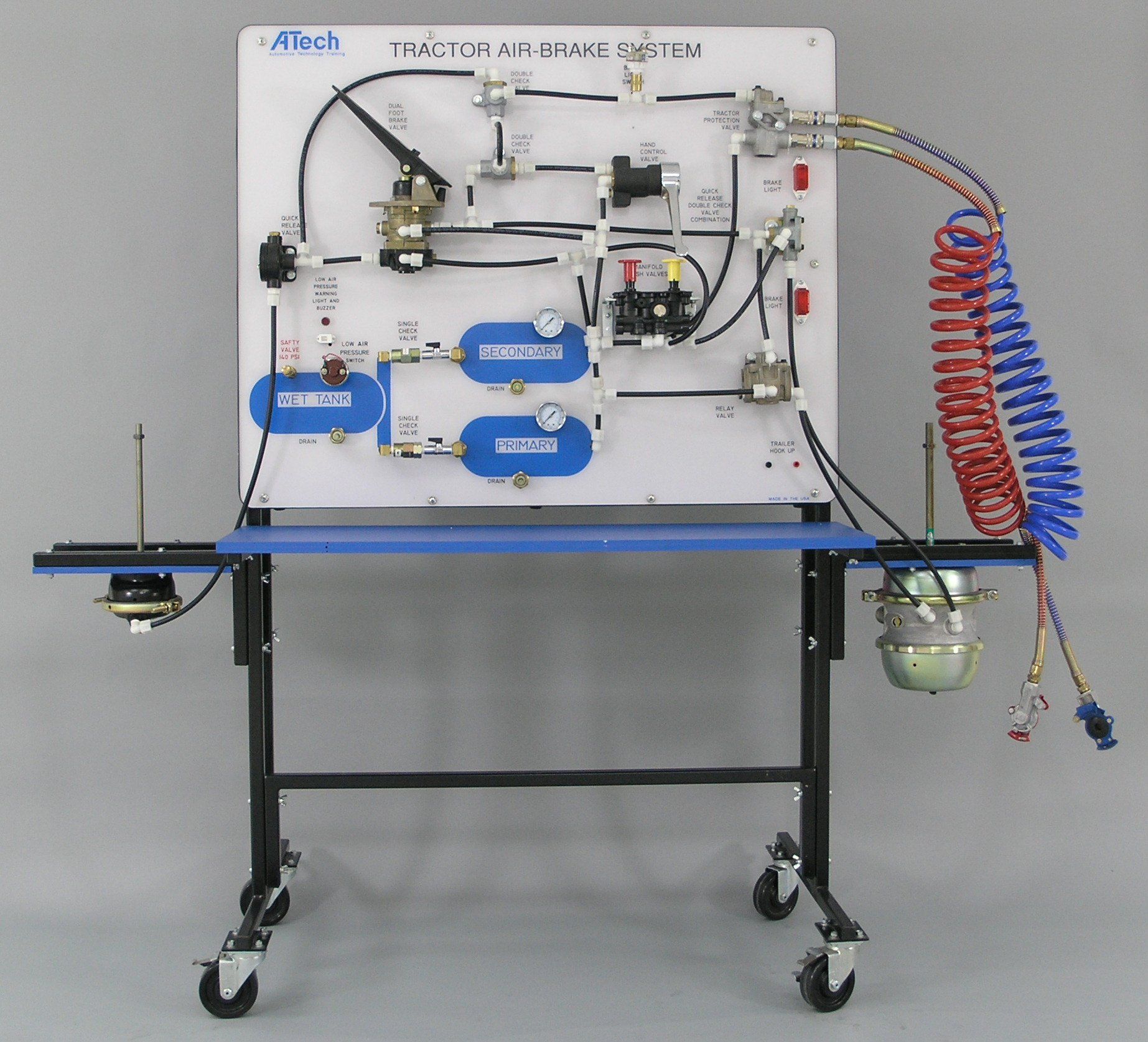 A tractor air brake system is displayed on a table