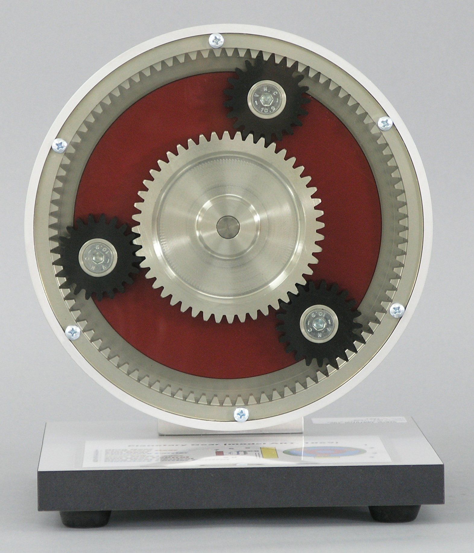 A circular object with three gears on it