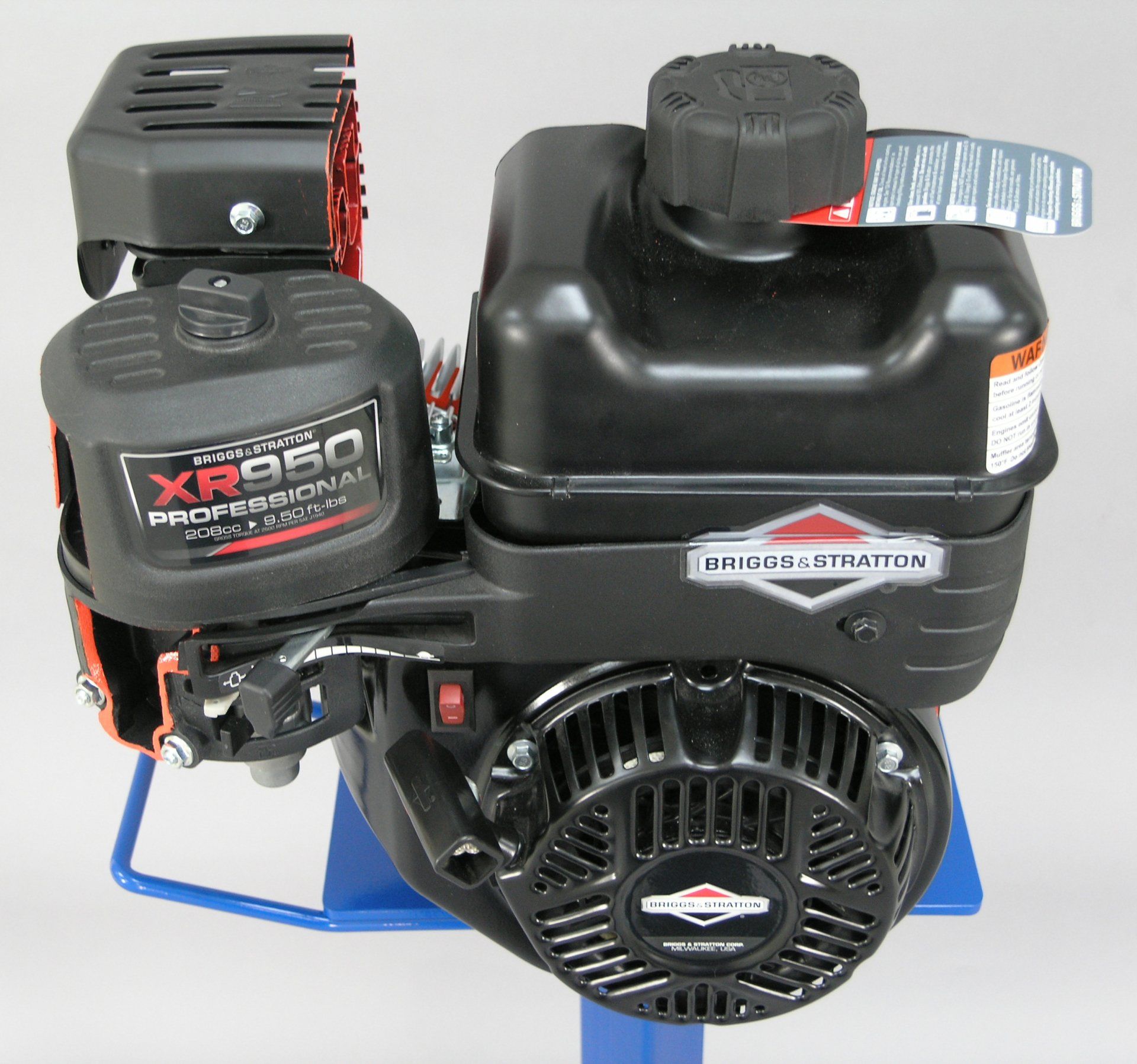 A briggs & stratton xr950 professional engine sits on a blue stand