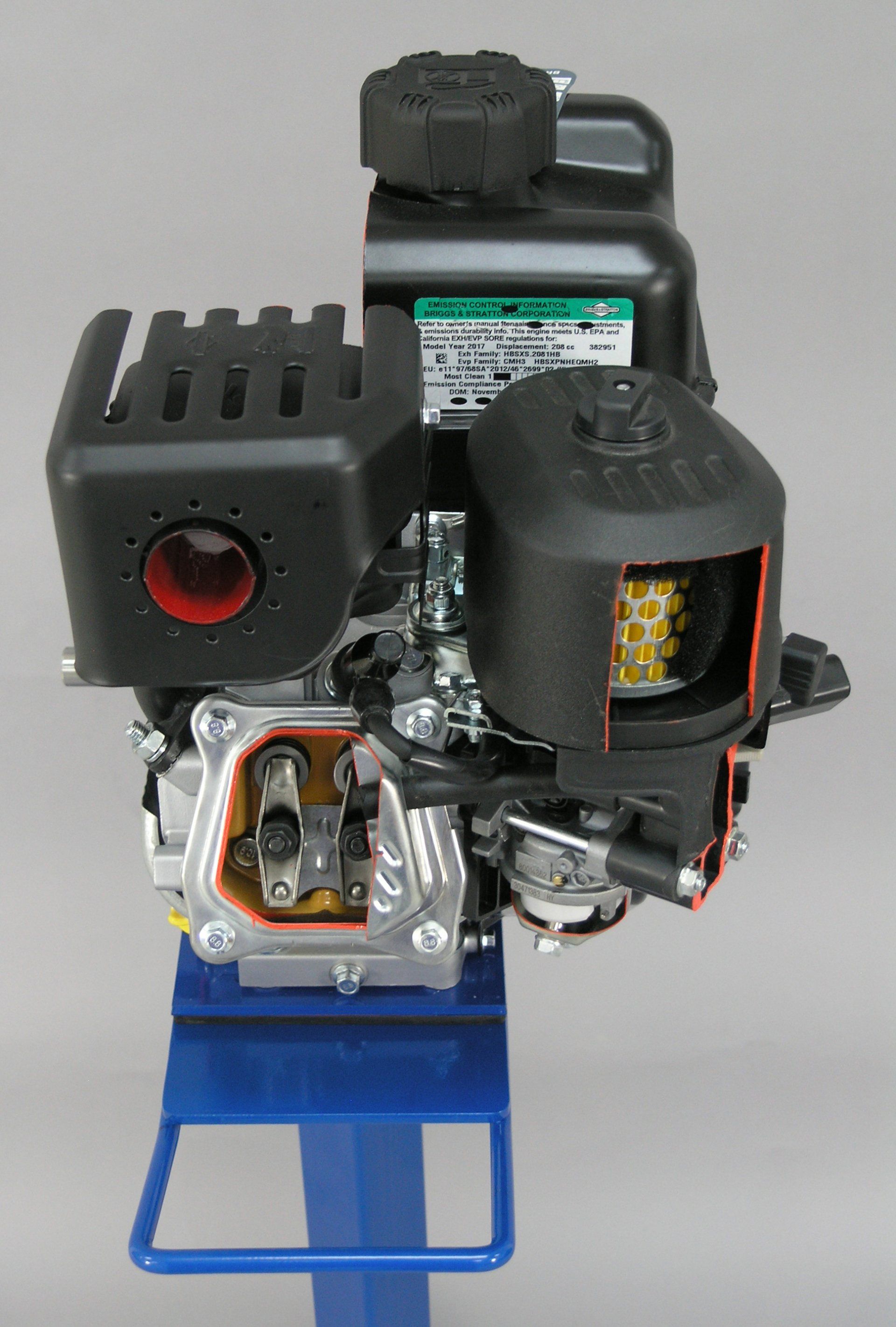 A small engine is sitting on top of a blue stand.