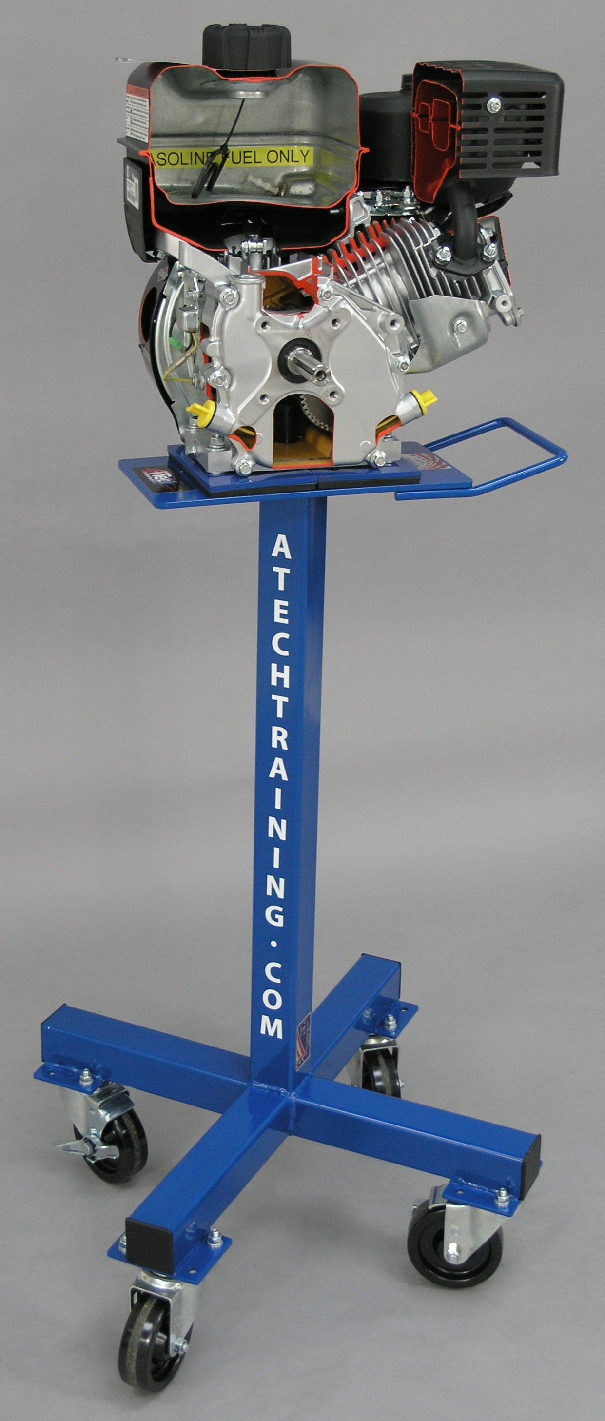 A small engine is sitting on top of a blue stand.