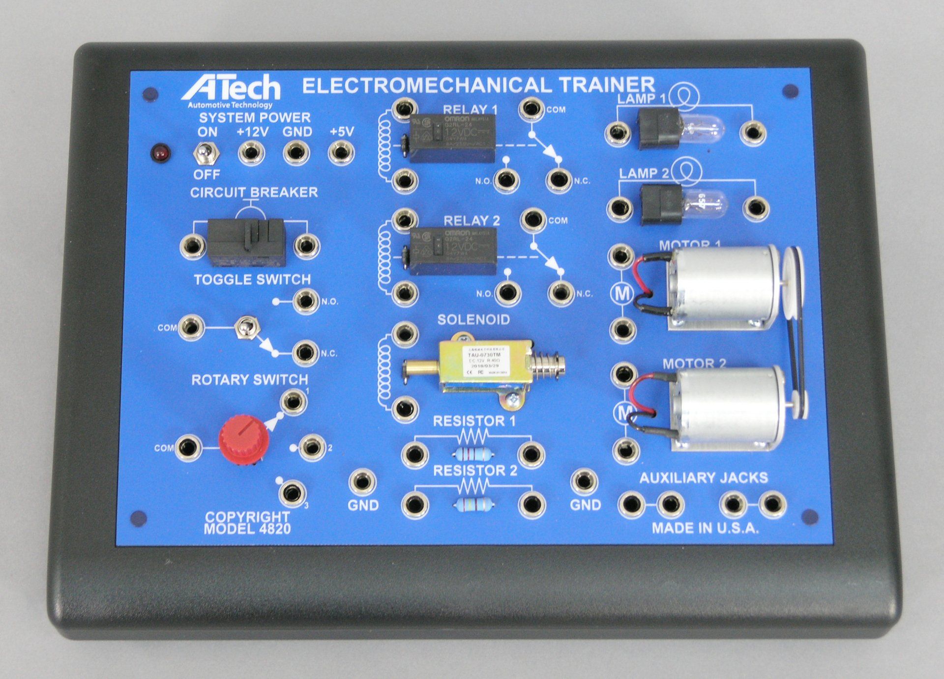 A tech electronic mechanical trainer is displayed on a table