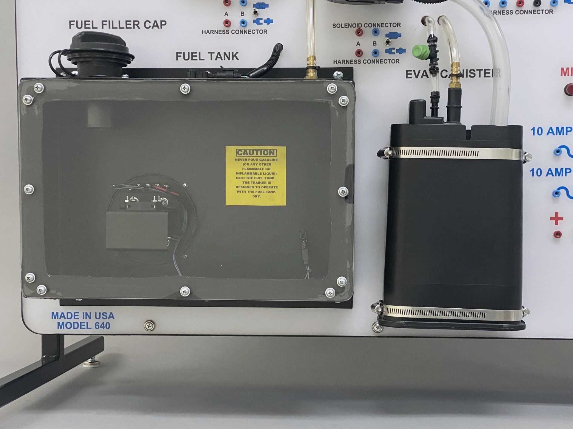 A fuel tank with a fuel filler cap on top of it
