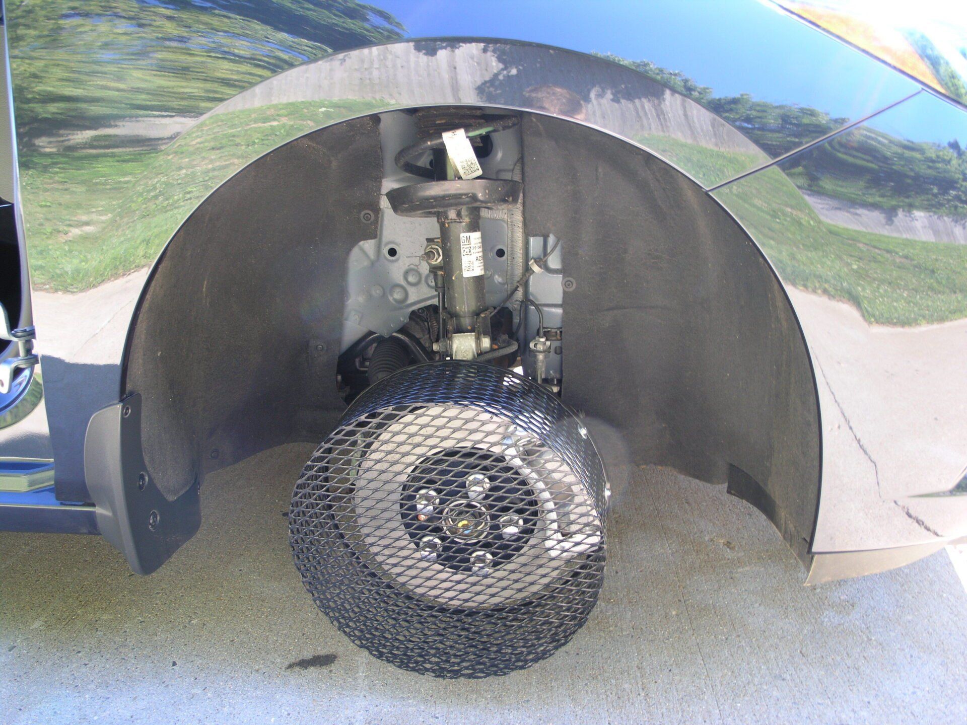 A close up of the front wheel of a car