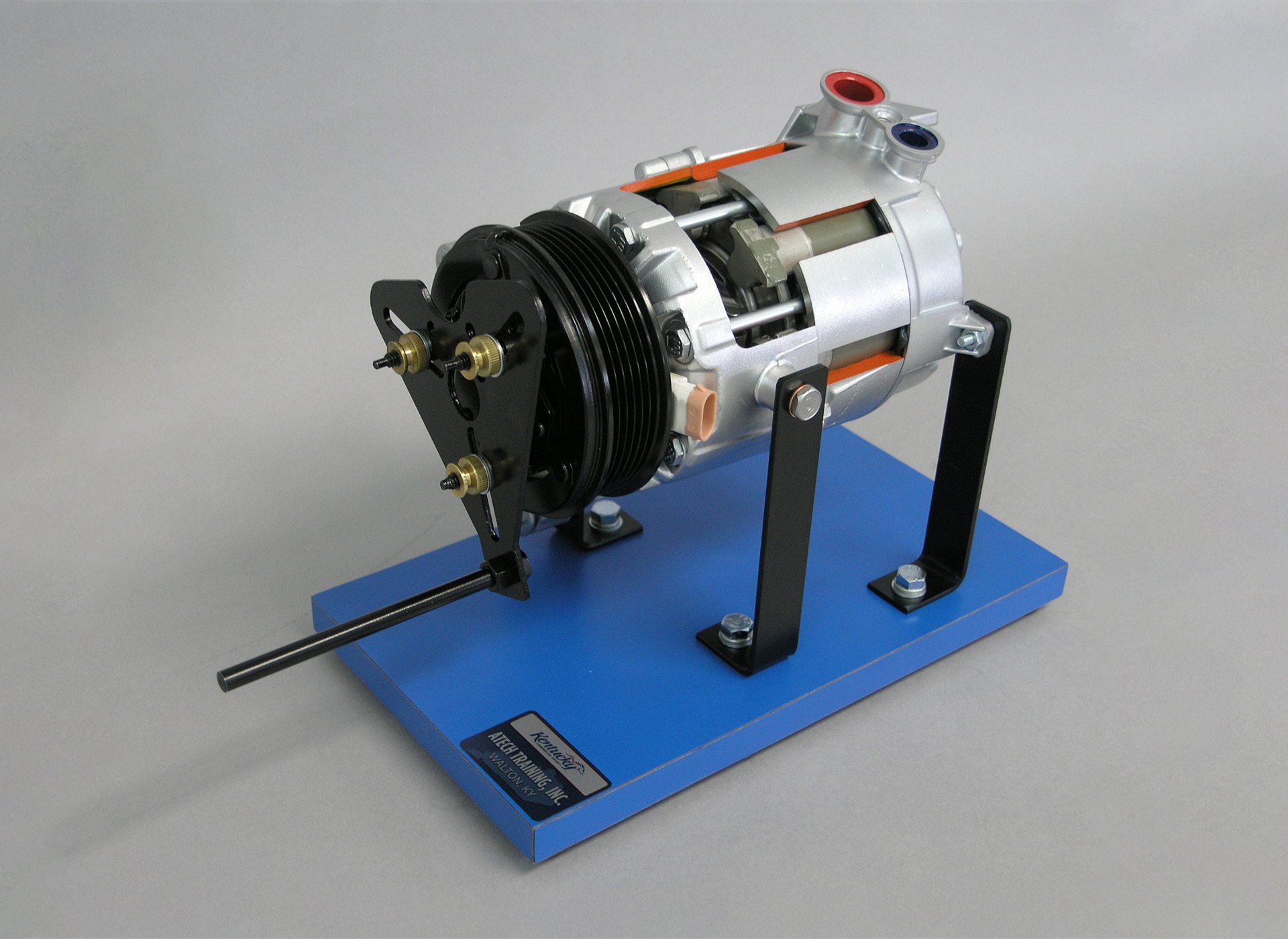 A model of a car air conditioner on a blue stand.
