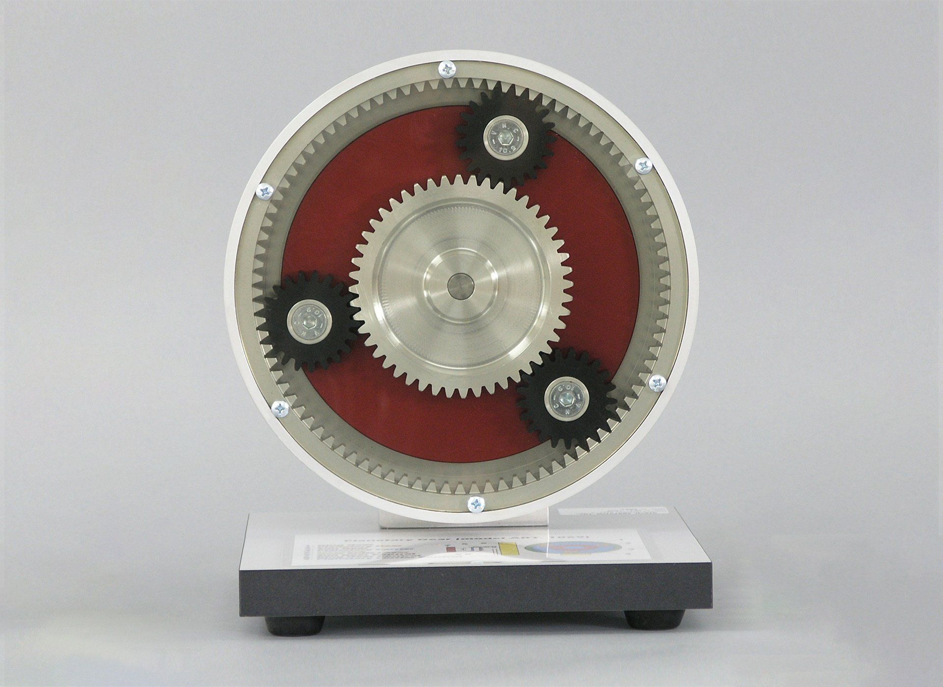 A circular object with three gears inside of it