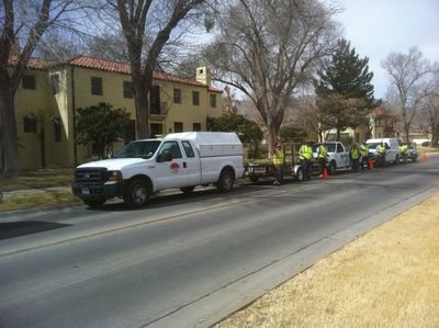 Landscaping — Pick-up Trucks and Workers Alongside the Road in El Paso, TX Landscaping — Pick-up Trucks and Workers Alongside the Road in El Paso, TX