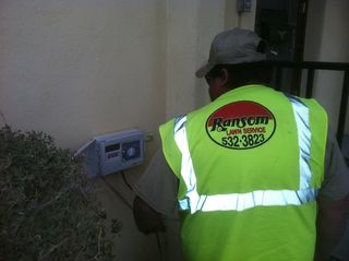 Irrigation Repair — Ranson Lawn Service Employee Wearing a Safety Vest in El Paso, TX Irrigation Repair — Ranson Lawn Service Employee Wearing a Safety Vest in El Paso, TX