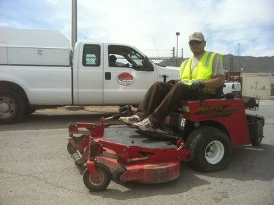 Grounds Maintenance — Employee Sitting on a Big Mower in El Paso, TX
