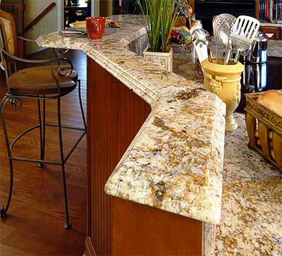Scottish Meadow Granite Countertops featuring a Waterfall Edge